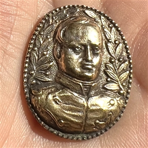 Cast white metal button of Napoleon.