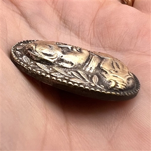 Cast white metal button of Napoleon.