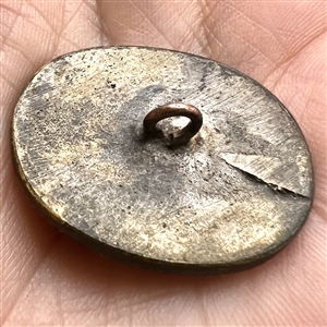 Cast white metal button of Napoleon.