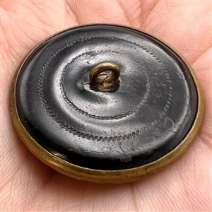 Rare large “Victorian Girl” ivoroid button.