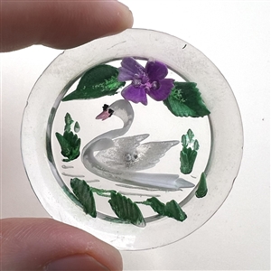Reverse carved acrylic button of swimming swan.