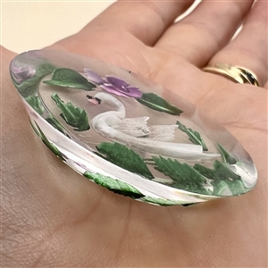 Reverse carved acrylic button of swimming swan.