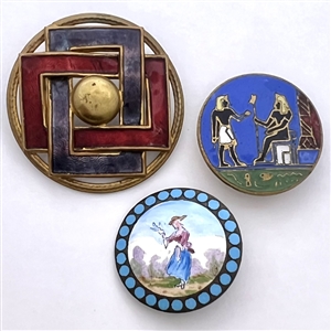 Two enamel buttons and one enamel stud.