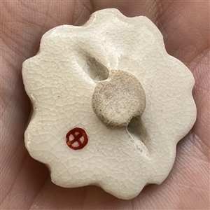 Unusual Japanese Satsuma button with irregular border of iris. 