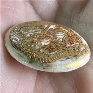 Japanese Satsuma button of gold and red dragon.