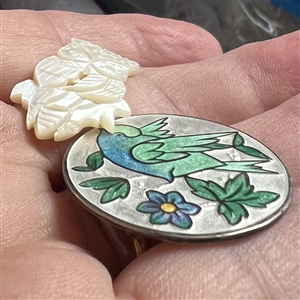 Two buttons of birds.