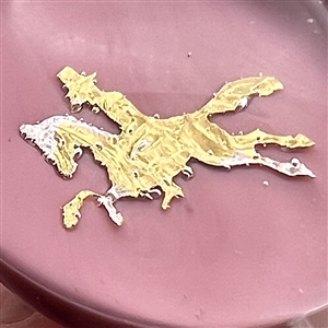 John Gooderham pink paperweight with gold foil horse and rider glass studio button.
