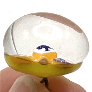 John Gooderham glass paperweight with spade in center studio button.