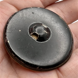 Imitation fire opal set in metal button with leaves. 