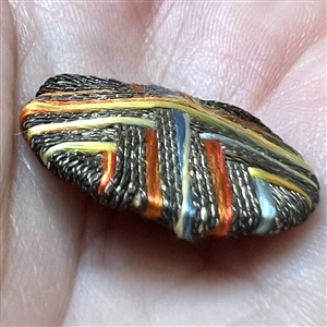 Colorful Death’s head fabric and bullion threads button.