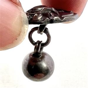 Asian silver toggle button.