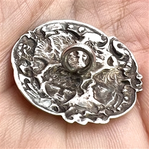 Hallmarked silver button of five cherub heads.