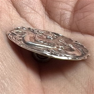 Hallmarked silver button of a “muse of music.