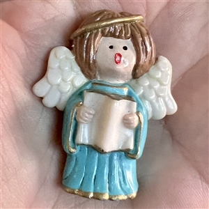 Realistic singing angel Jasperware studio button by Stella Rzanski. 