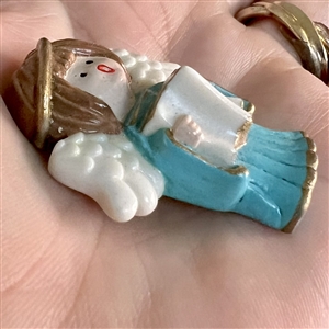 Realistic singing angel Jasperware studio button by Stella Rzanski. 