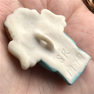 Realistic singing angel Jasperware studio button by Stella Rzanski. 
