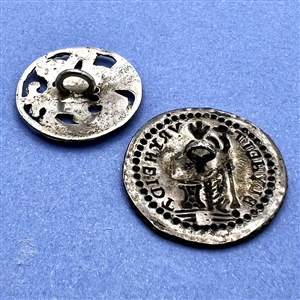 Two silver buttons of people.