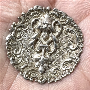 White metal lion “door knocker button.