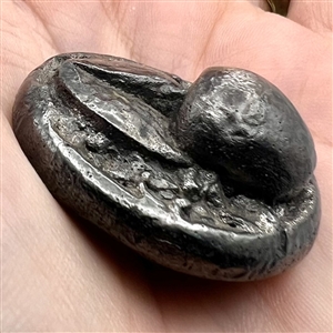 Metalized molded plastic button of a cherry.