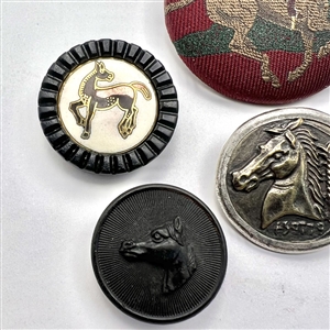 Six assorted horse buttons.