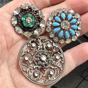 Three jewel buttons.