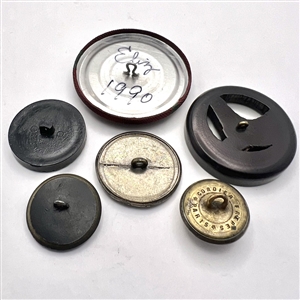 Six assorted horse buttons.