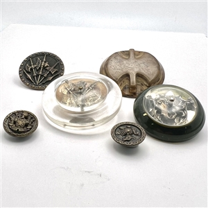 Six assorted weapon and armor buttons. 