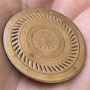 An 18th c. chased copper Colonial target button.