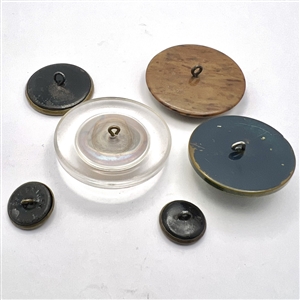 Six assorted weapon and armor buttons. 