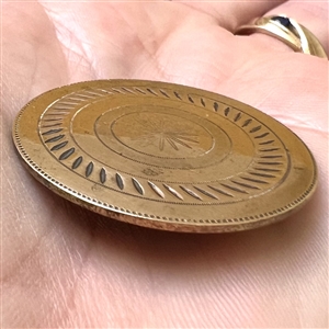 An 18th c. chased copper Colonial target button.