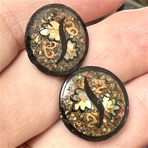Two exquisite watch crystal buttons. 