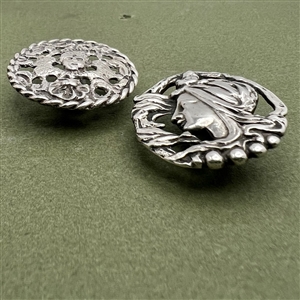 Two hallmarked silver buttons of heads.