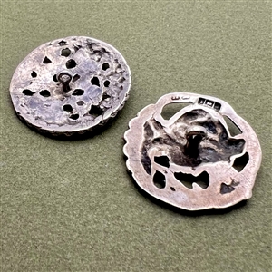 Two hallmarked silver buttons of heads.