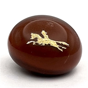 John Gooderham red paperweight with gold foil horse and rider glass studio button.