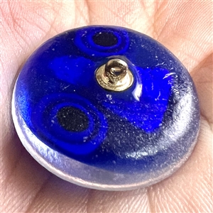 Glass studio paperweight button with sulphide by Theresa Rarig.