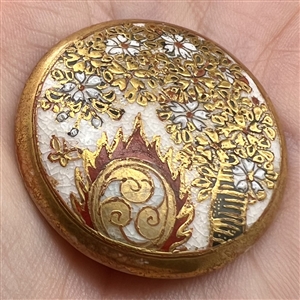 Large Satsuma button depicting large decorated drum used with bugaku dance performances.