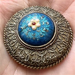 A 19th c. Basse-taille enamel button of a flower.