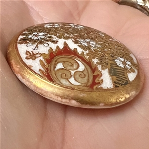 Large Satsuma button depicting large decorated drum used with bugaku dance performances.