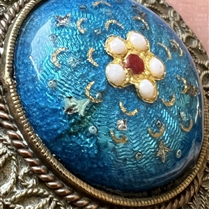 A 19th c. Basse-taille enamel button of a flower.