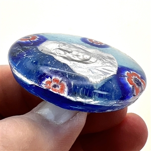 Glass studio paperweight button with sulphide of Benjamin Franklin by Theresa Rarig.