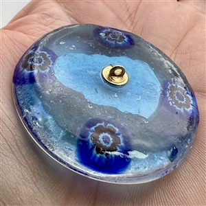 Glass studio paperweight button with sulphide of Benjamin Franklin by Theresa Rarig.