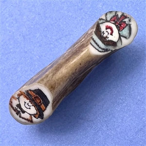 Studio button on antler with pilgrims.