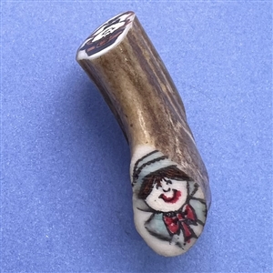 Studio button on antler with pilgrims.