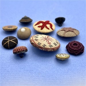 Eleven fabric buttons.