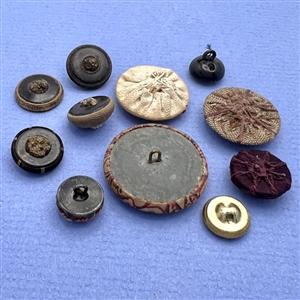 Eleven fabric buttons.