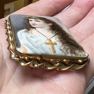 Extra large religious button of girl with cross necklace.