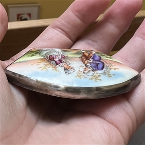 Extra large unusual shaped porcelain button of a courting couple.