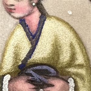 Painting on fabric button of an Asian woman.