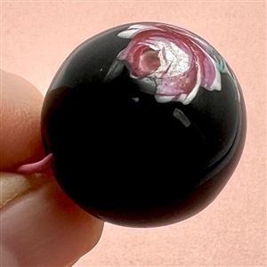 Ceramic ball button with painted rose.