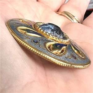 Gorgeous 19th c. enamel button with see through blue faceted glass jewel.